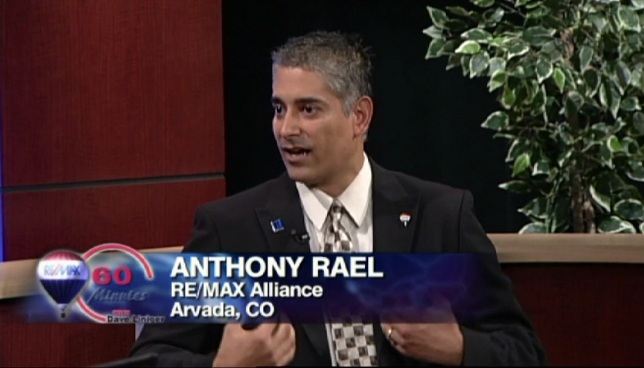 Anthony Rael speaking with RE/MAX CEO Dave Liniger